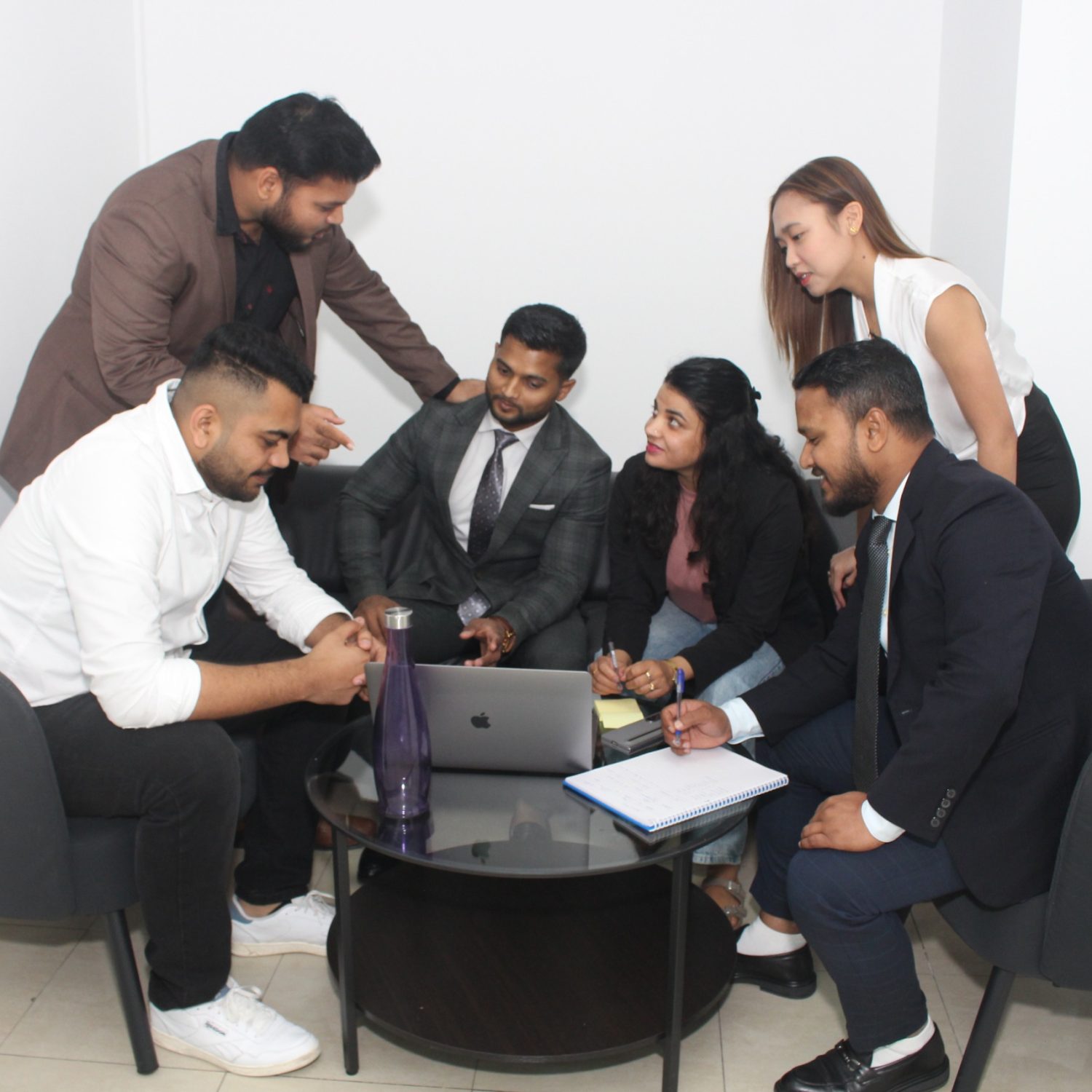 Galaxy Prime Mortgage Brokers UAE team members discussing work